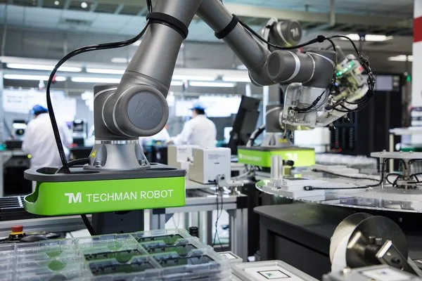 Techman cobot arm performing pick‑and‑place automation in Malaysia factory